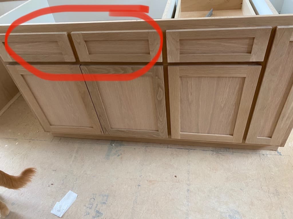 Cabinet defect circled in red — real Field annotation